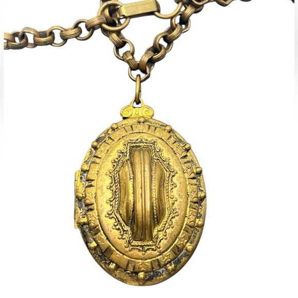 Victorian Etruscan Revival gold tone oval locket pendant on chain necklace